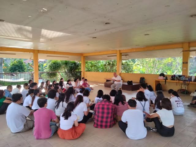 FC facilitators gathered in a circle during a formation session